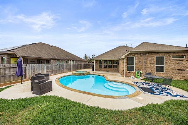 view of swimming pool featuring an in ground hot tub and a patio area