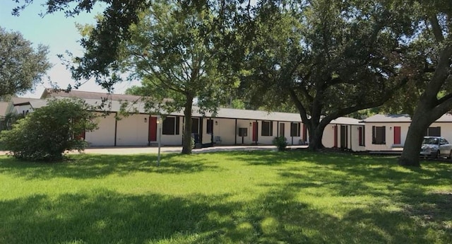 rear view of house with a yard