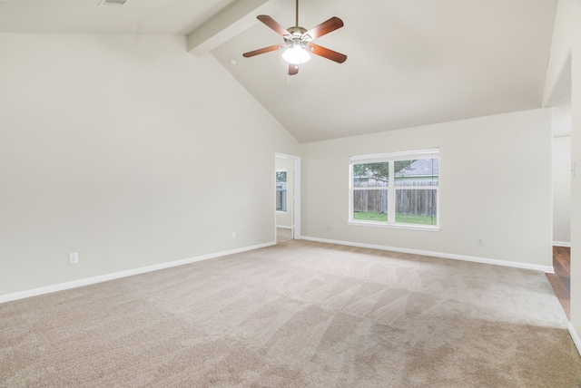 carpeted spare room featuring beam ceiling, high vaulted ceiling, and ceiling fan