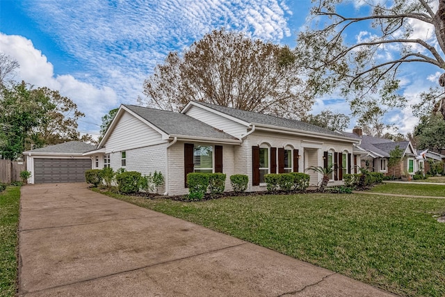 single story home featuring a garage and a front lawn