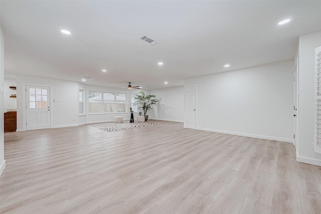 unfurnished living room with light wood-type flooring