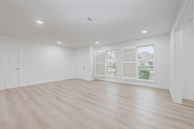 spare room featuring light wood-type flooring