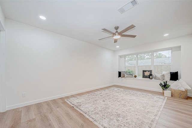 interior space with ceiling fan and light hardwood / wood-style floors