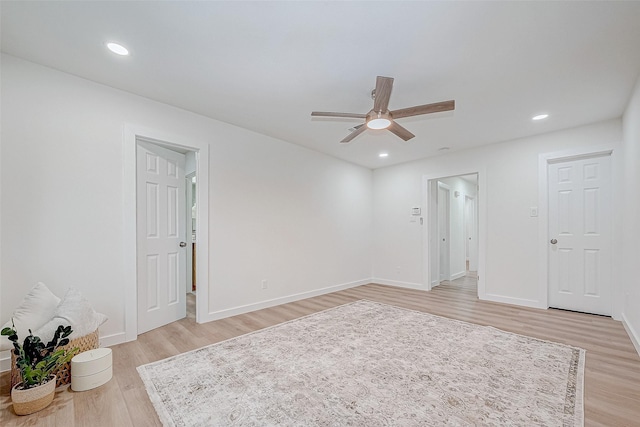 unfurnished room featuring ceiling fan and light wood-type flooring