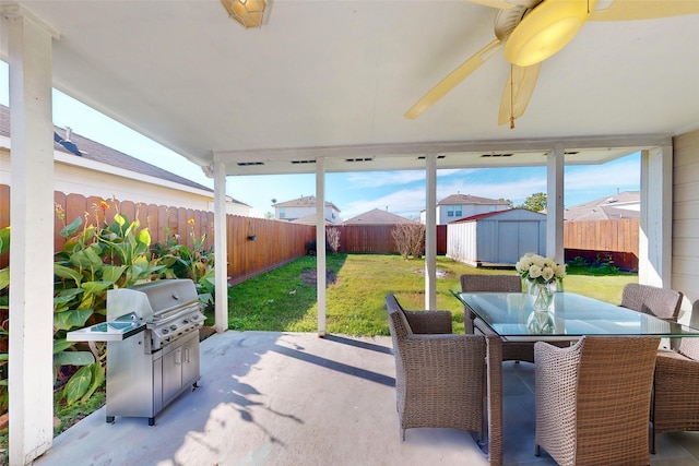 view of patio / terrace with a storage unit and grilling area