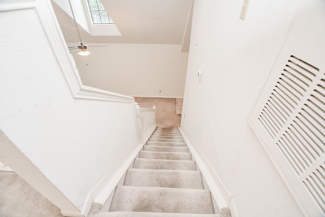 stairway with ceiling fan