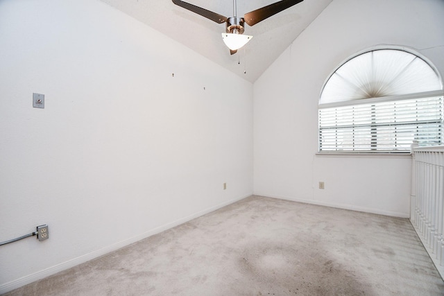 unfurnished room featuring light carpet, vaulted ceiling, and ceiling fan