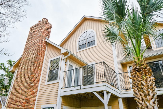 back of house with a balcony