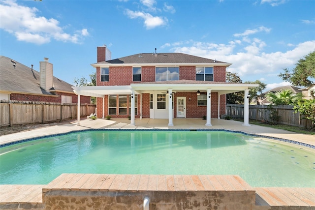 view of swimming pool featuring a patio area and ceiling fan