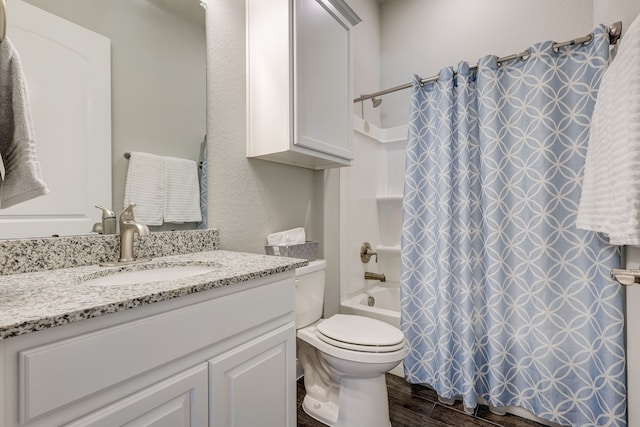 full bathroom with toilet, vanity, hardwood / wood-style flooring, and shower / tub combo with curtain