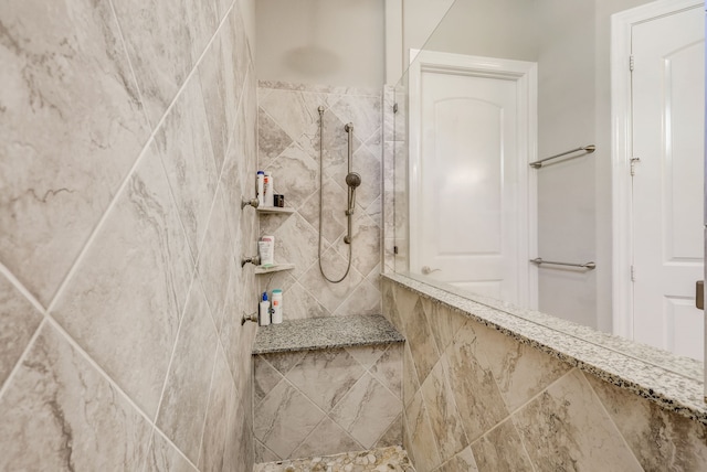 bathroom featuring tiled shower