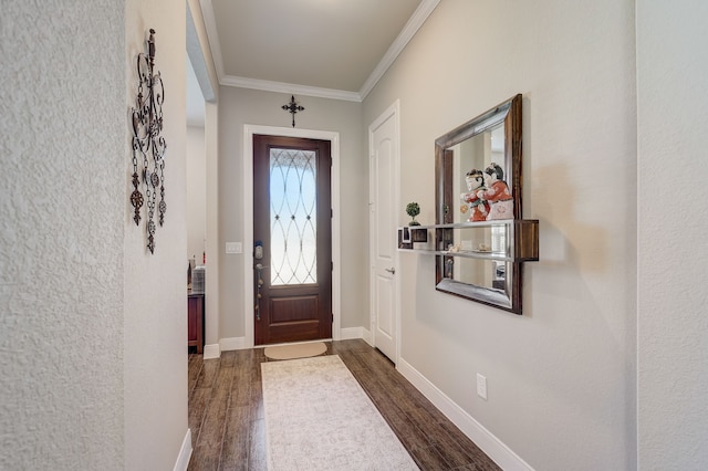 foyer entrance with dark hardwood / wood-style floors and ornamental molding