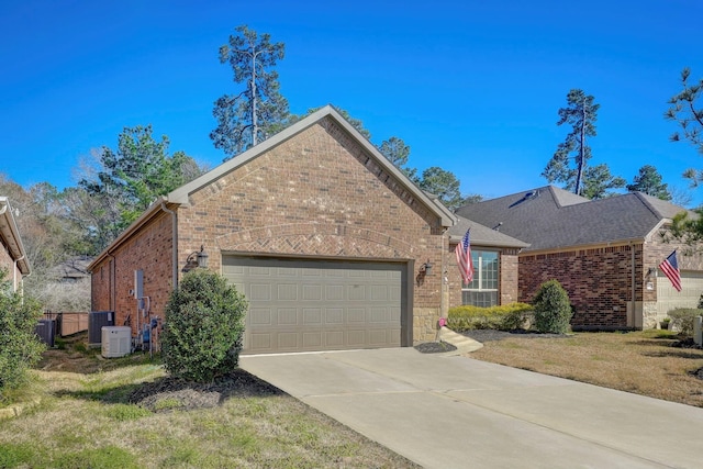 view of front of house featuring central AC, a front lawn, and a garage