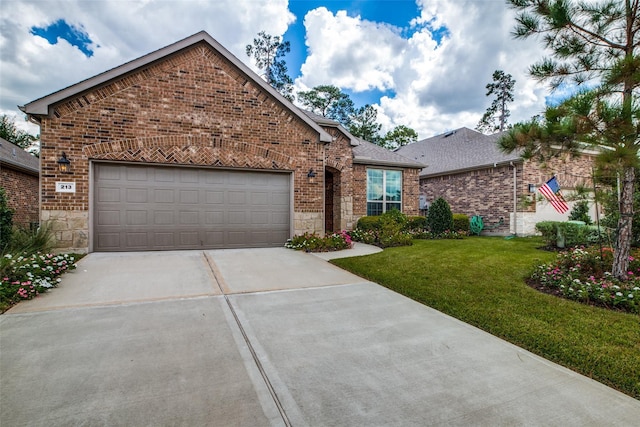 view of front of property with a garage and a front lawn