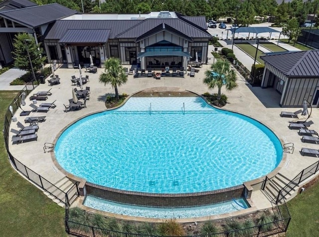 view of swimming pool with a patio