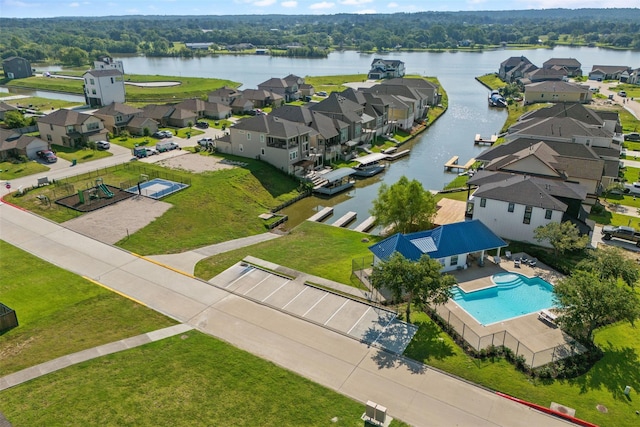 birds eye view of property with a water view