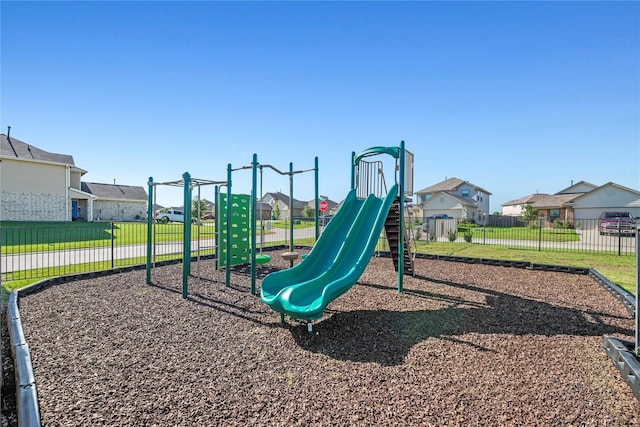 view of jungle gym featuring a lawn