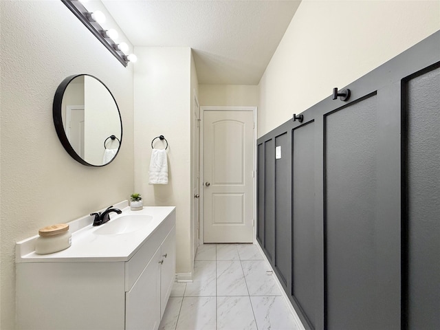 bathroom featuring vanity and a textured ceiling