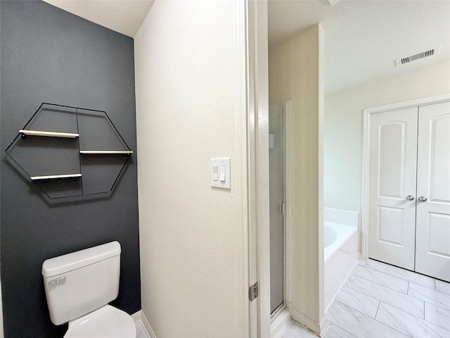 bathroom featuring a bathing tub and toilet