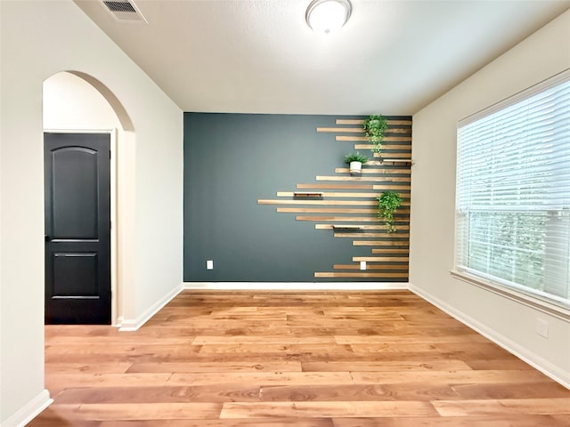 spare room with light hardwood / wood-style flooring