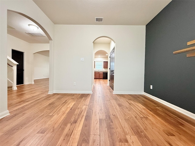 empty room with light wood-type flooring