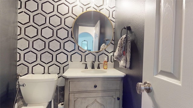 bathroom with vanity and toilet