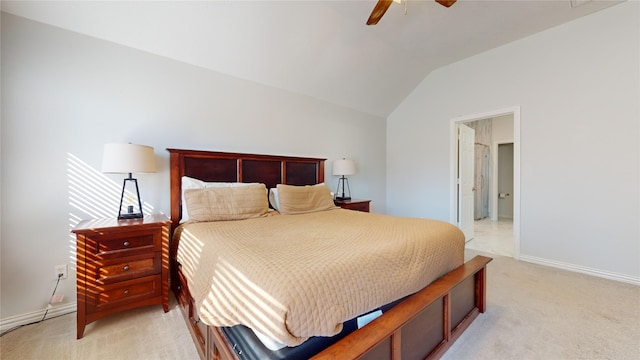 carpeted bedroom featuring ceiling fan and vaulted ceiling