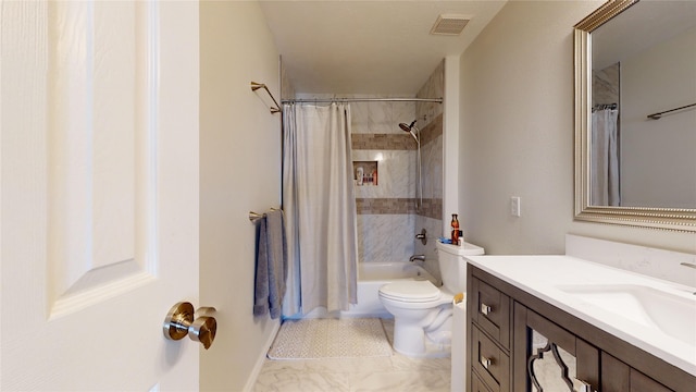 full bathroom featuring shower / tub combo, vanity, and toilet