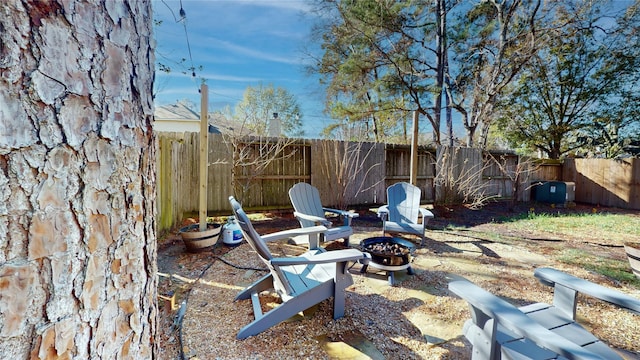 view of yard with a fire pit