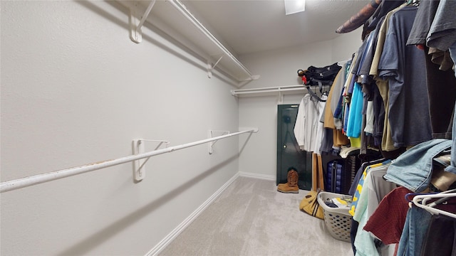 walk in closet featuring carpet floors