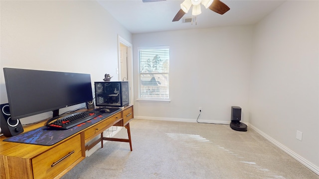 office area featuring light carpet and ceiling fan