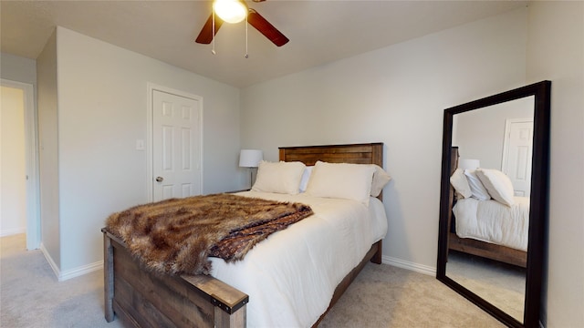 bedroom with ceiling fan and light carpet