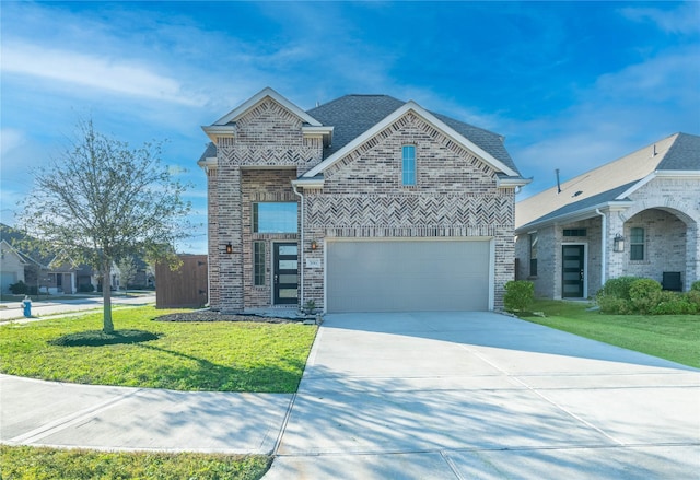 view of front of property featuring a front yard and a garage