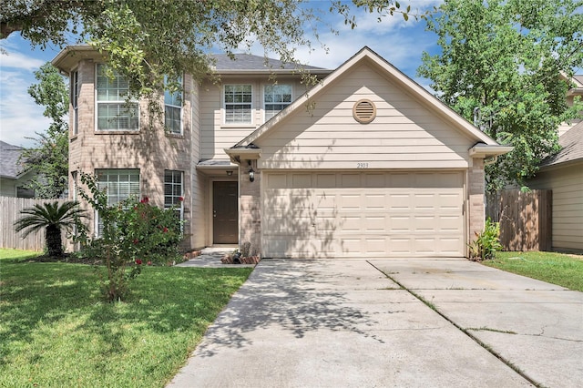 view of front of house featuring a garage and a front lawn