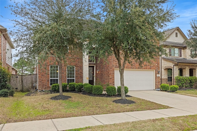 view of front of home featuring a garage and a front lawn