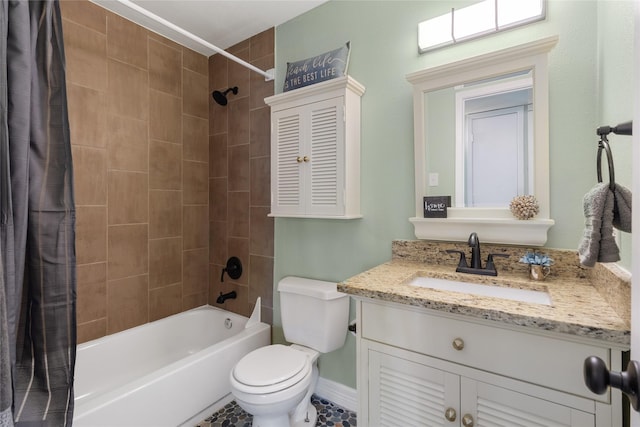 full bathroom with shower / bath combo, vanity, and toilet