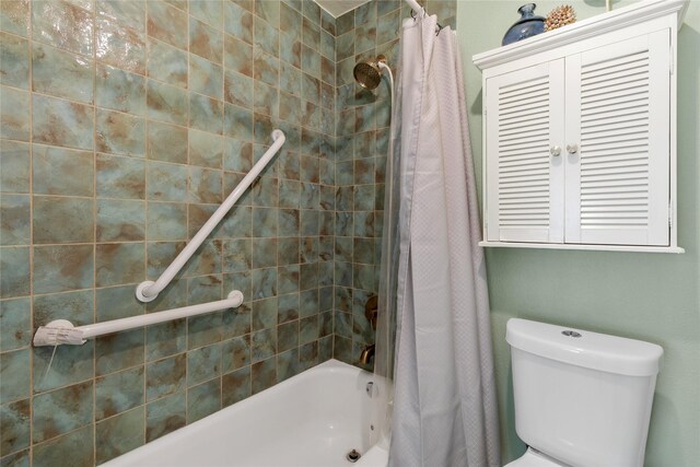 bathroom with shower / bath combination with curtain and toilet