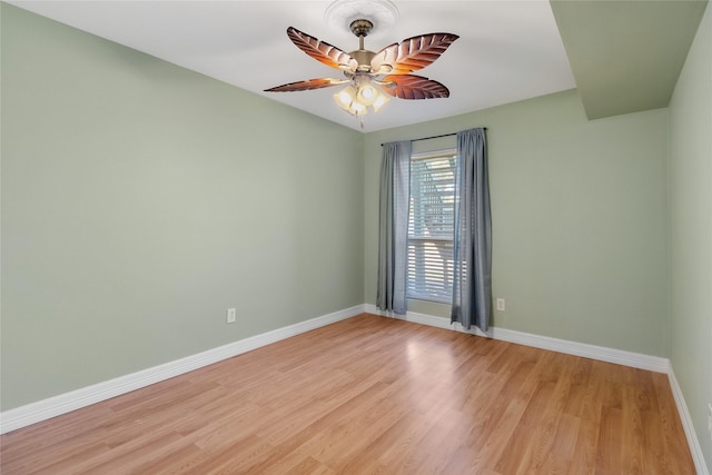 empty room with light hardwood / wood-style flooring and ceiling fan