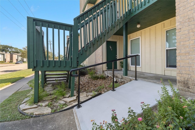 exterior space featuring board and batten siding and a patio area