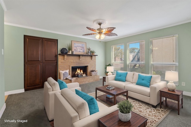 carpeted living room with a fireplace, ceiling fan, and crown molding