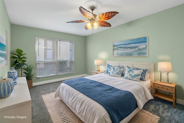 carpeted bedroom with ceiling fan