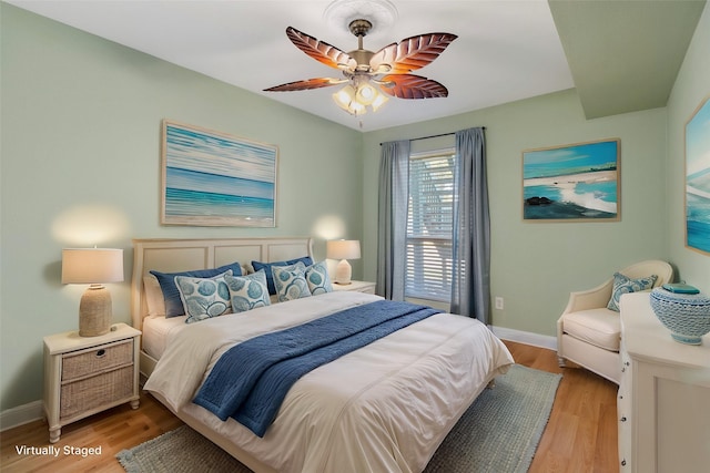 bedroom featuring light hardwood / wood-style flooring and ceiling fan