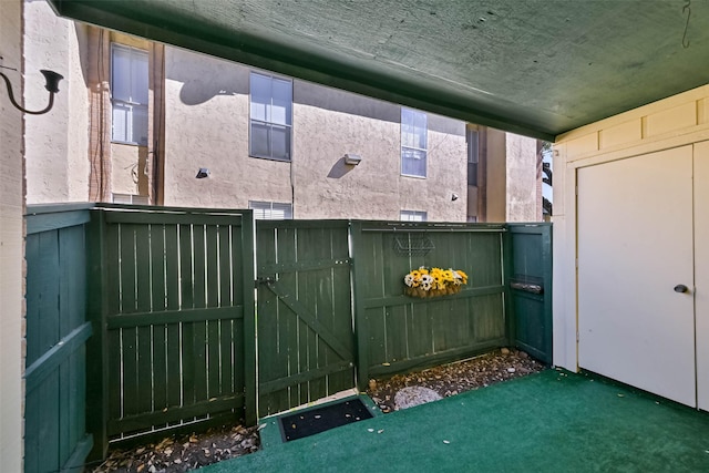 view of gate featuring fence
