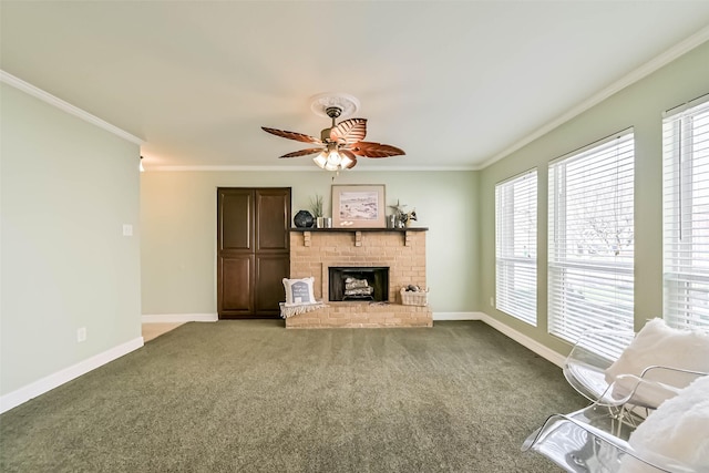 unfurnished living room featuring a ceiling fan, a brick fireplace, crown molding, and baseboards