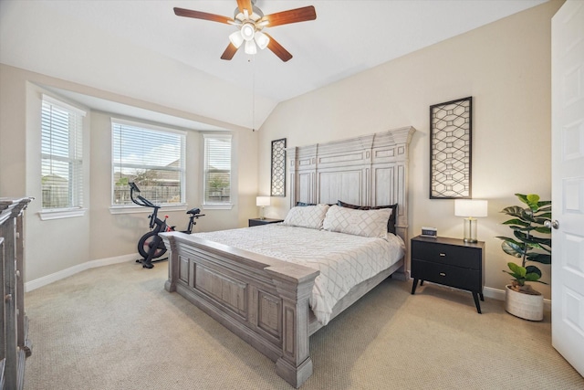 carpeted bedroom featuring ceiling fan and vaulted ceiling