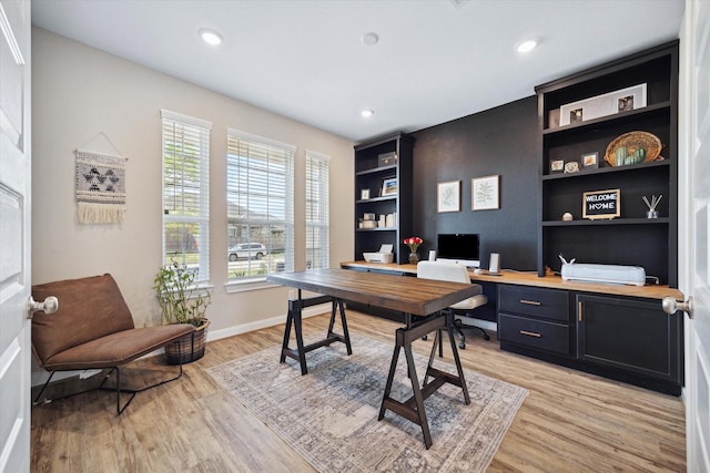 office with light wood-type flooring