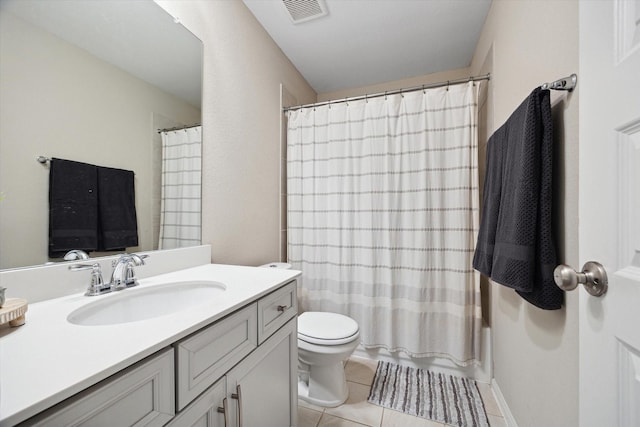 bathroom with tile patterned floors, vanity, and toilet