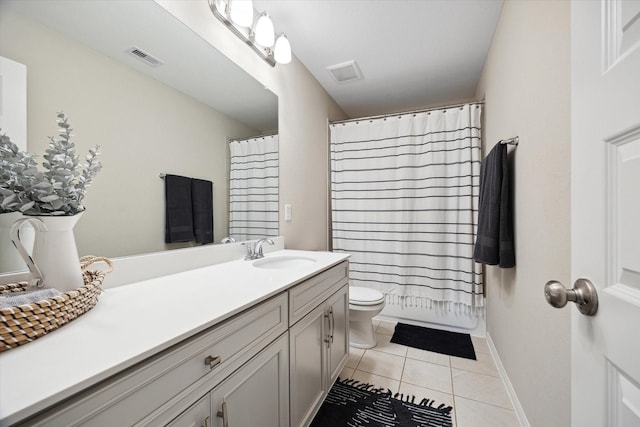 bathroom featuring tile patterned floors, vanity, toilet, and walk in shower