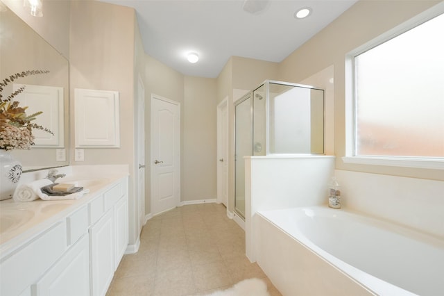 bathroom featuring vanity and shower with separate bathtub