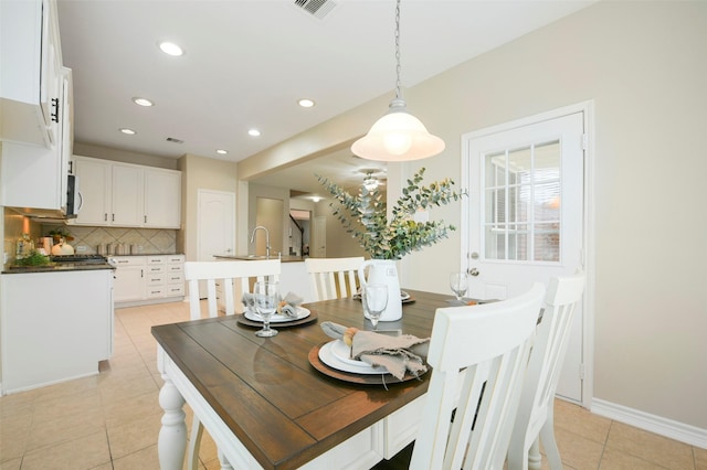 dining room featuring light tile patterned flooring